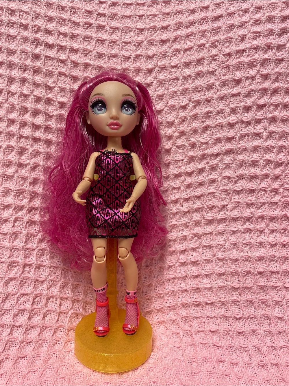 Rainbow High -  Fashion Doll with Long Pink Hair and pink and black clothing.